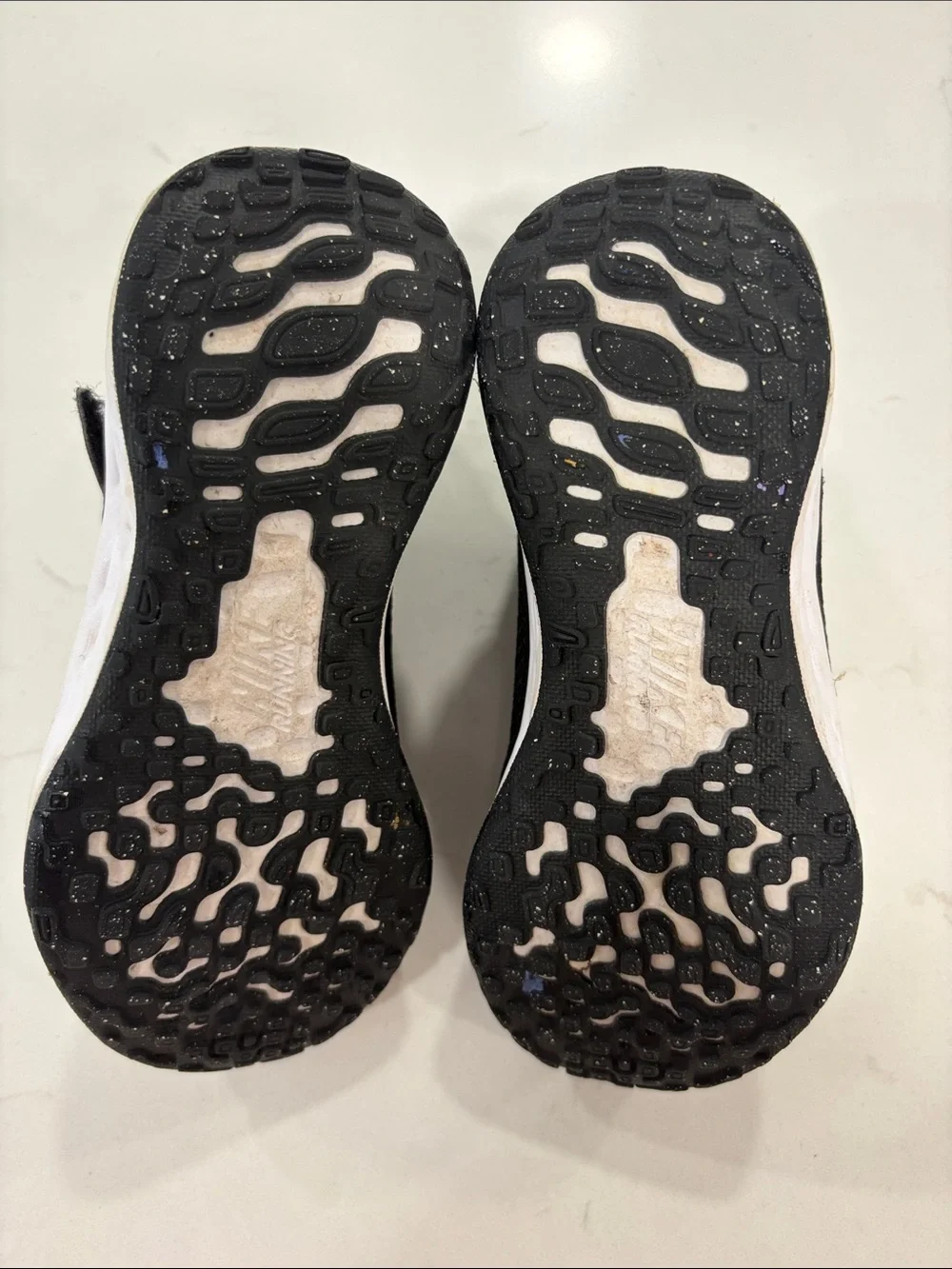 Nike Kids Black Sneakers with Pink Swoosh